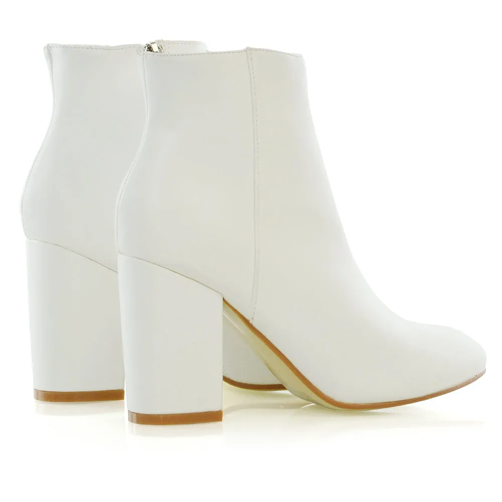 PEACHES CHUNKY BLOCK HIGH HEEL ZIP UP ANKLE WINTER BOOTS IN WHITE SYNTHETIC LEATHER